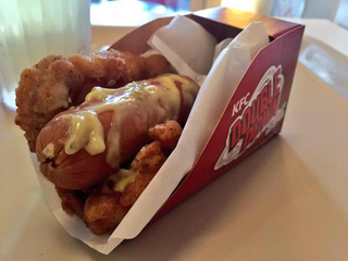 Illustration for article titled KFC's Double Down hot dog is a sausage wrapped in a fried chicken bun